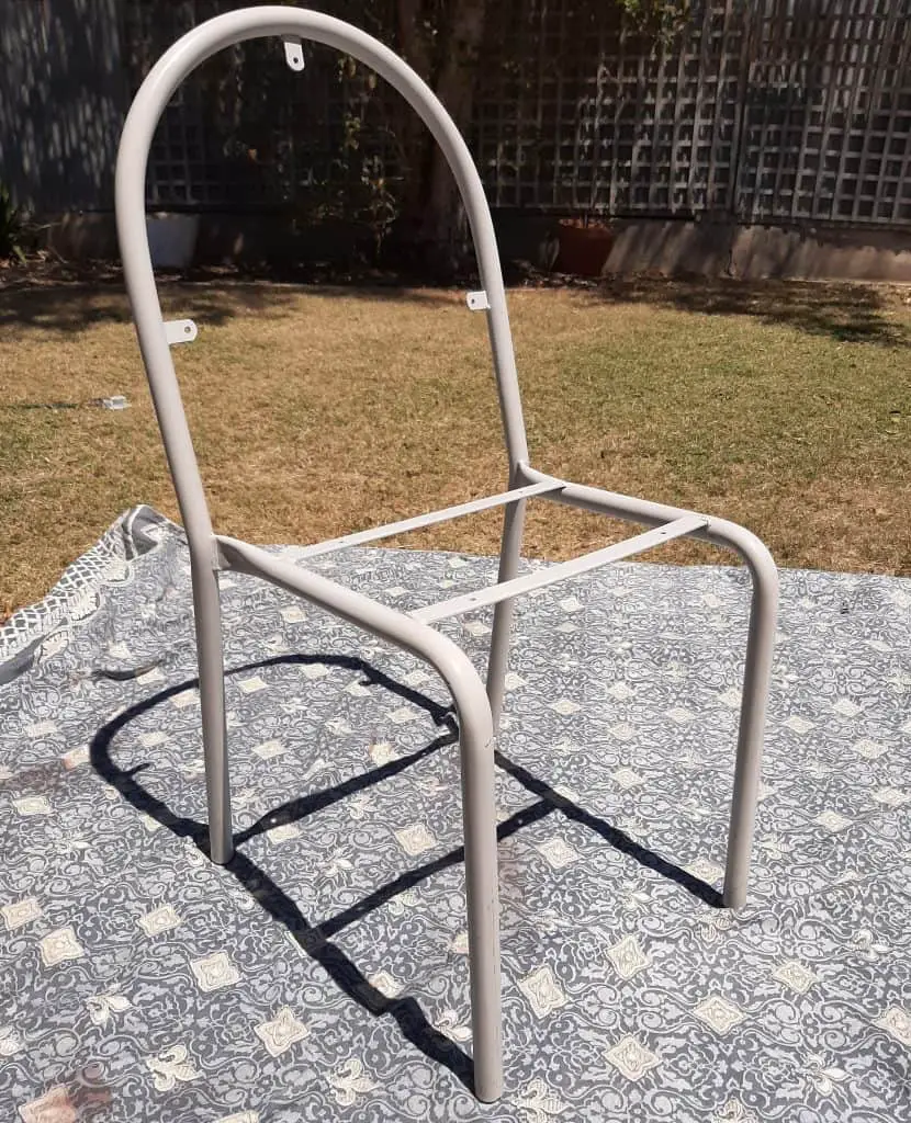 Old chair frame sanded before being painted