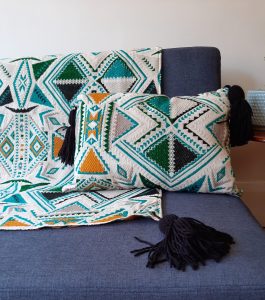 Plumbago aztec range pillows. Set of two pillows and a throw on sofa.