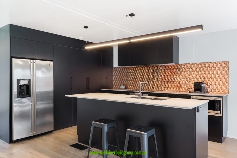 Cronulla - stylish black kitchen with copper back-splash