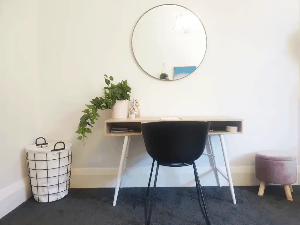 DIY Bedroom makeover - desk with plant and mirror above.
