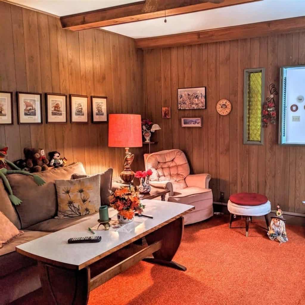 1970s living room with dark wood paneling on walls