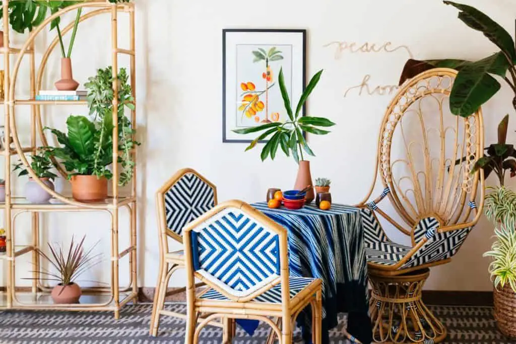 rattan furniture 70s revival. rattan dining table and chairs, peacock chair and rattan bookcase