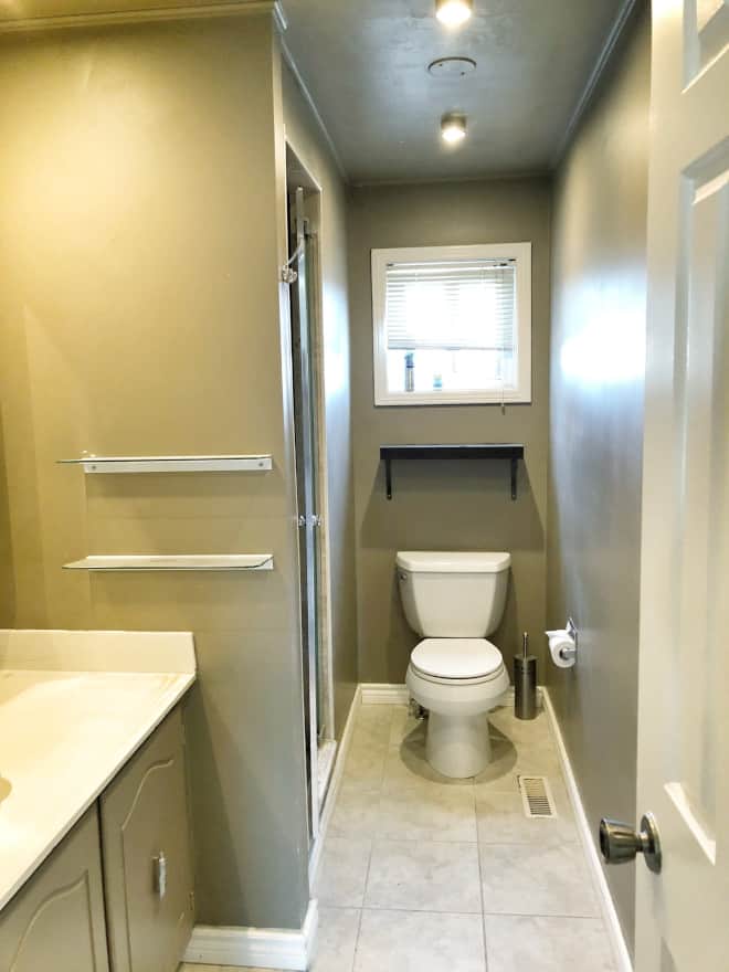 Before bathroom renovation by Simply Beautiful Eating via Home Bunch. Dark, closed in bathroom.