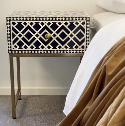 Ethically sourced bone inlay black side table in bedroom