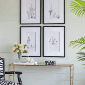 Set of 4 Steeple building prints on wall above console table