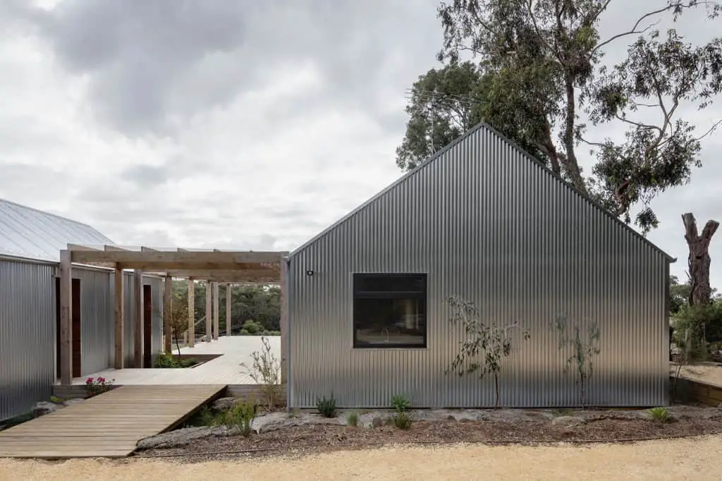 Bellbrae shed house with galvanised metal cladding two buildings with linking courtyard