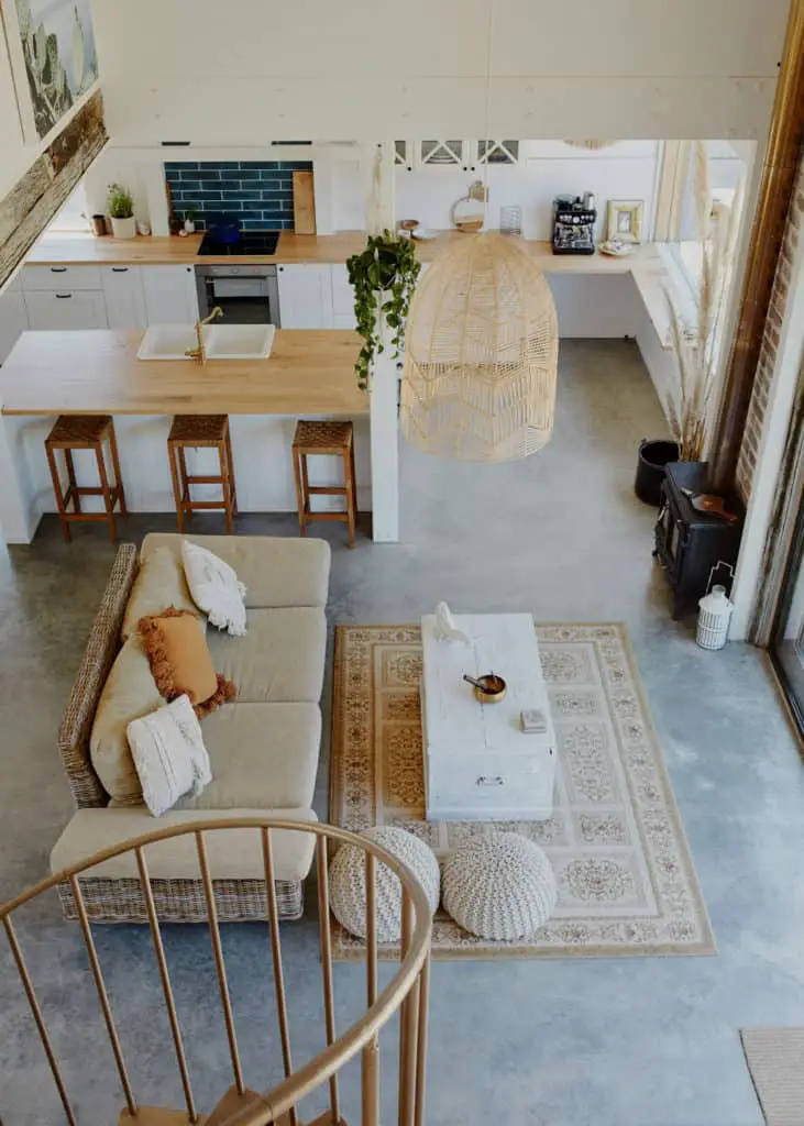 Rhys Uhlich's Shed house interior. Recycled pallet kitchen and large open plan living, dining and kitchen space.