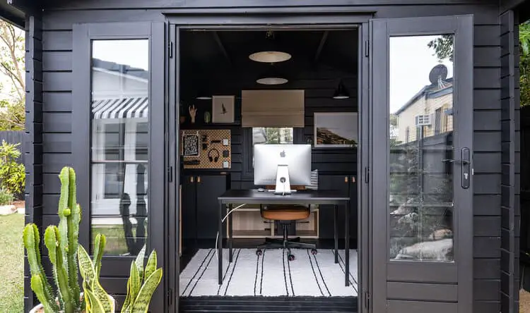 Mark's studio shed looking in to desk with doors open